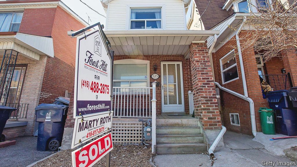 TORONTO, ON - MAY 6: The average sale price of a detached house in the City of Toronto is expected to hit $1 million in April for the first time. Active listings were down 8.4 per cent, a persistent problem which has been driving significant price growth. This home at near Ossington Avenue with a unique coach house in the back, sold for $1 million in April 2014. (Carlos Osorio/Toronto Star via Getty Images)