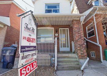 TORONTO, ON - MAY 6: The average sale price of a detached house in the City of Toronto is expected to hit $1 million in April for the first time. Active listings were down 8.4 per cent, a persistent problem which has been driving significant price growth. This home at near Ossington Avenue with a unique coach house in the back, sold for $1 million in April 2014. (Carlos Osorio/Toronto Star via Getty Images)