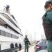 Civil Guards stand by the yacht called Tango in Palma de Mallorca, Spain, Monday April 4, 2022. U.S. federal agents and Spain's Civil Guard are searching the yacht owned by a Russian oligarch. The yacht is among the assets linked to Viktor Vekselberg, a billionaire and close ally with Russia's President Vladimir Putin, who heads the Moscow-based Renova Group, a conglomerate encompassing metals, mining, tech and other assets, according to U.S. Treasury Department documents. All of Vekselberg's assets in the U.S. are frozen and U.S. companies are forbidden from doing business with him and his entities. (AP Photo/Francisco Ubilla)
